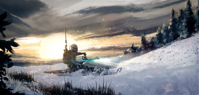 Snowmobile rider in a snowy landscape at sunset