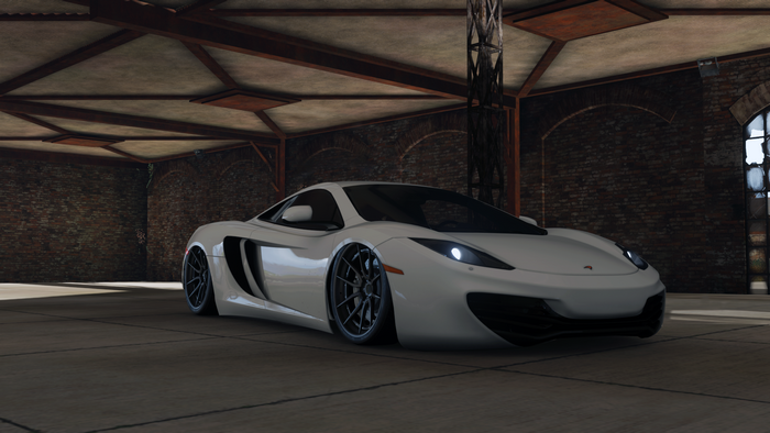 White McLaren 12C in a garage