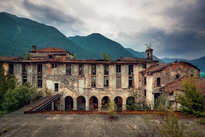 Abandoned building in front of mountains