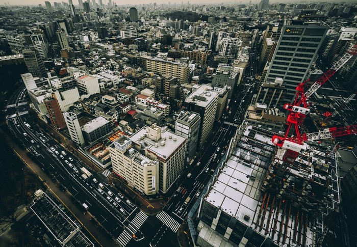 Aerial view of Tokyo cityscape with construction crane
