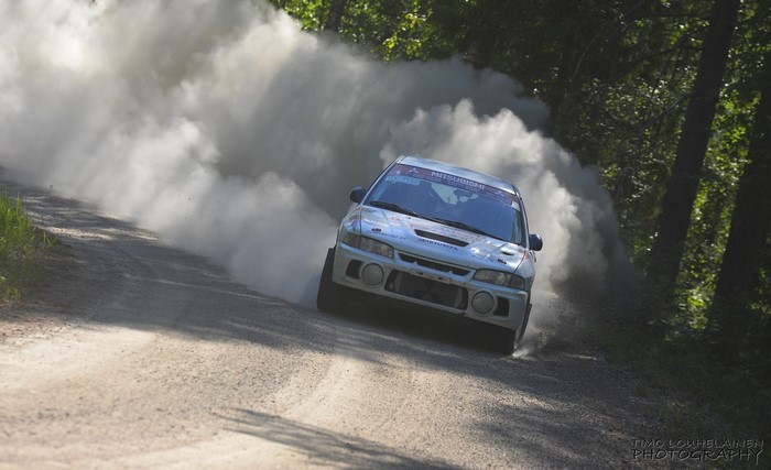 Mitsubishi Lancer EVO rally car kicking up dust