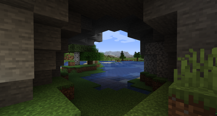 Minecraft cave opening overlooking a lake and mountains