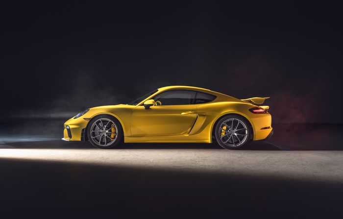 Yellow Porsche 718 Cayman sports car side view