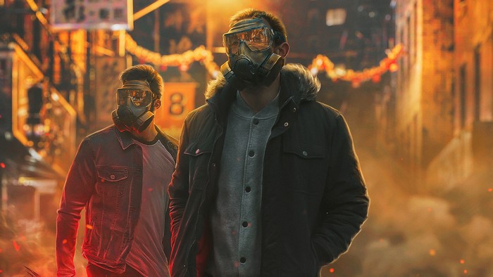 Two men wearing gas masks in a city