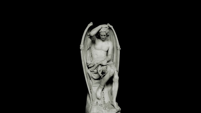 Statue of a winged figure chained