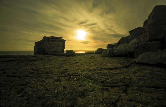 4K long exposure photography of rocky beach at sunset