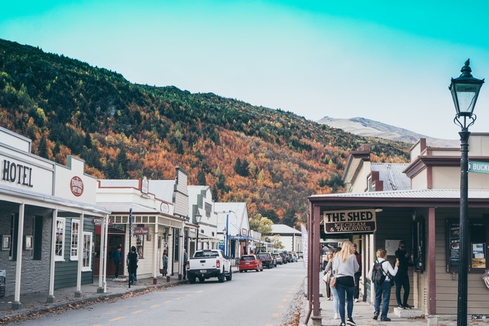 Street scene in Queenstown, New Zealand with autumn foliage
