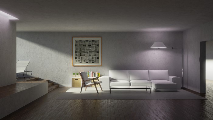 Modern living room with abstract artwork and white couch