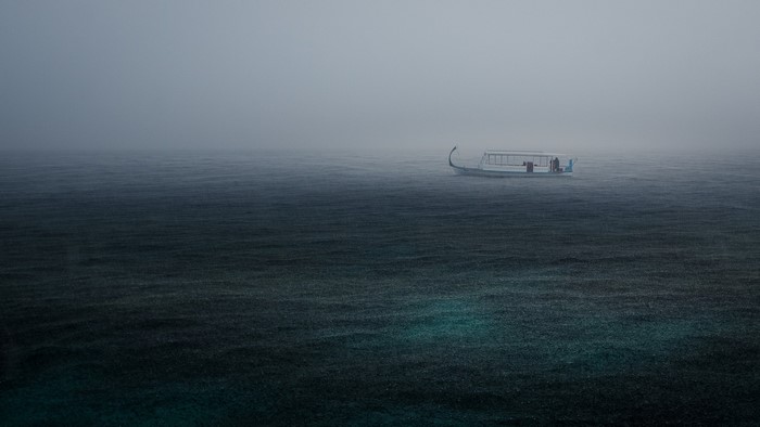 Boat in the mist on the water