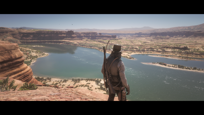 John Marston from Red Dead Redemption 2 overlooking a river