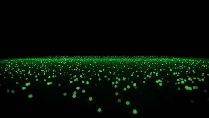 Abstract green glowing particles on black background