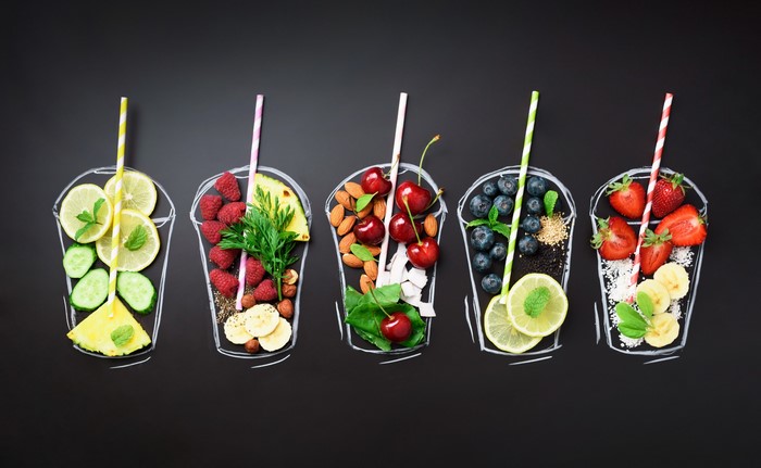 Colorful Smoothie Ingredients on Black Chalkboard