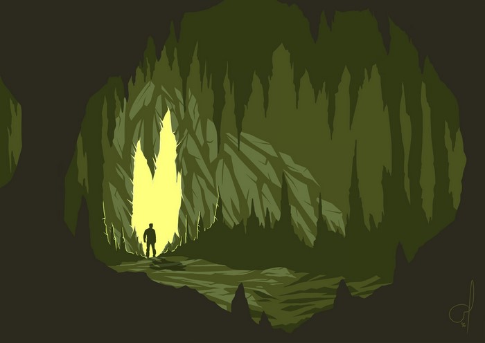 Silhouette of a man in a dark cave with glowing entrance