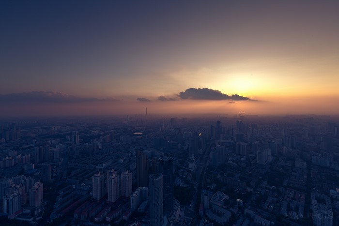 Cityscape at sunset with hazy sky
