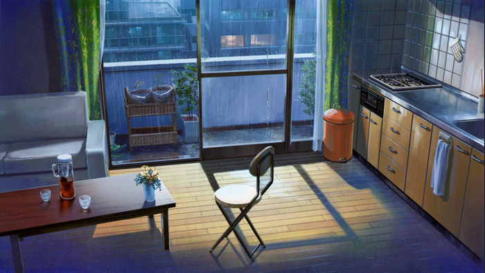 Interior of a kitchen and living area during rain