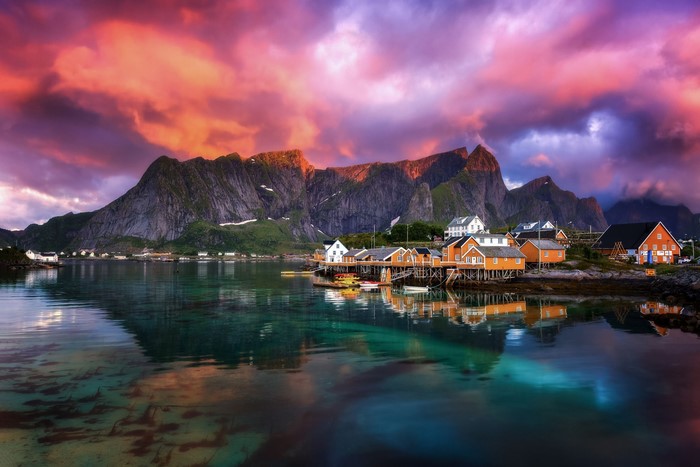 Sakrisøy village with colorful houses and mountains in Lofoten, Norway