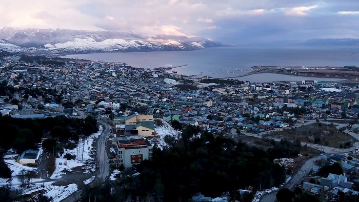 Ushuaia cityscape with snow-capped mountains and bay