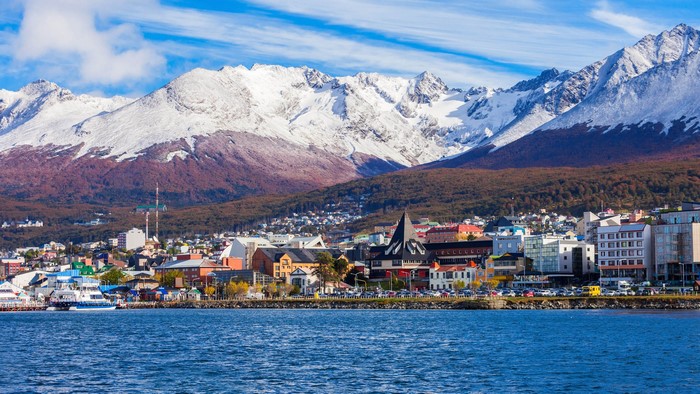 Ushuaia city with snow-capped mountains and bay