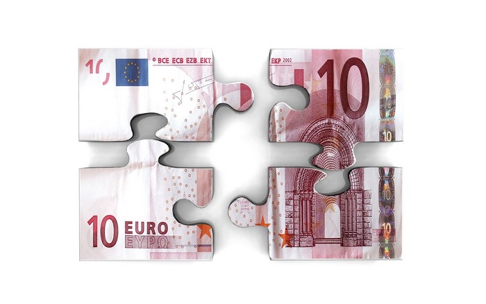 Four puzzle pieces of a 10 Euro banknote