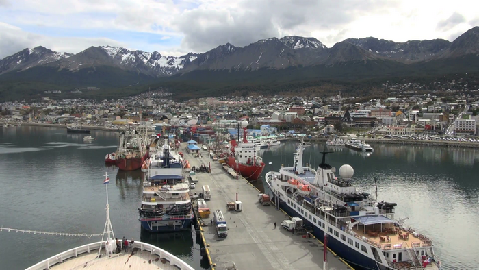 Ships docked in Ushuaia, Patagonia with mountains in background