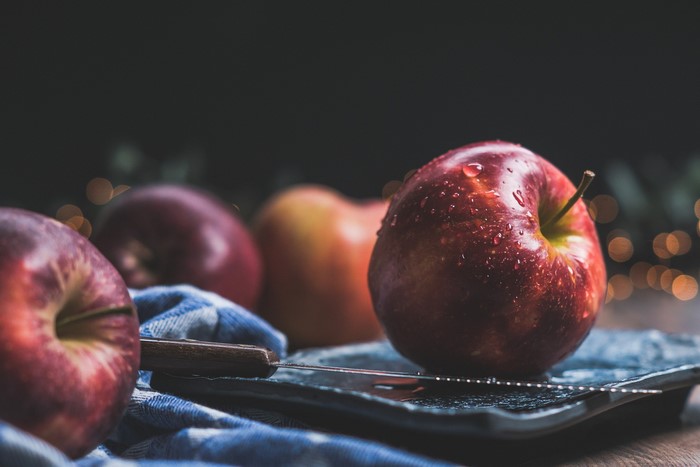 Apples on a plate with a knife and fork
