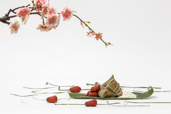 Zongzi with dates and rice on a leaf