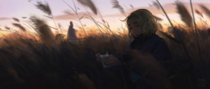 Girl in a field at sunset