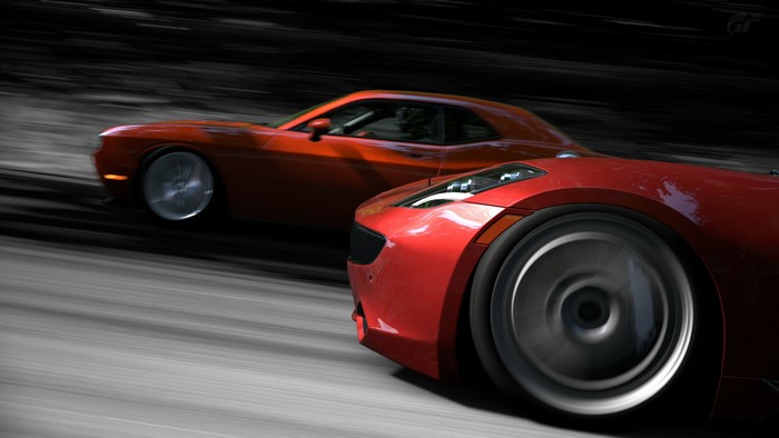 Two red sports cars racing
