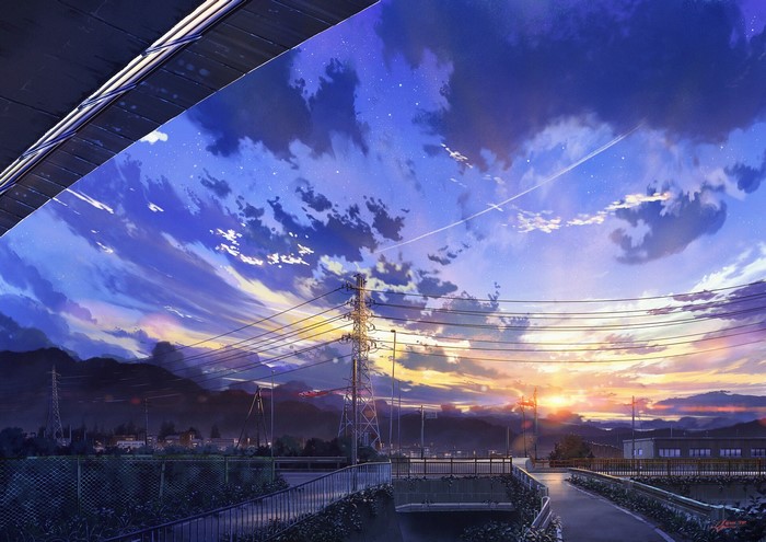 Sunset over a Japanese town with power lines