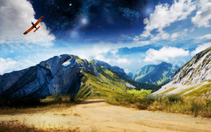 Airplane flying over mountains under starry sky