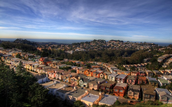Colorful houses on a hillside overlooking the ocean in San Francisco
