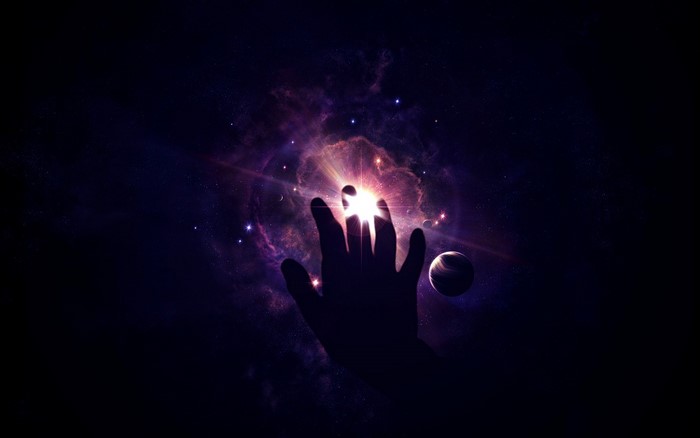 Hand reaching into a bright nebula in space