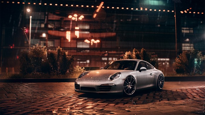 Silver Porsche 911 in the rain at night
