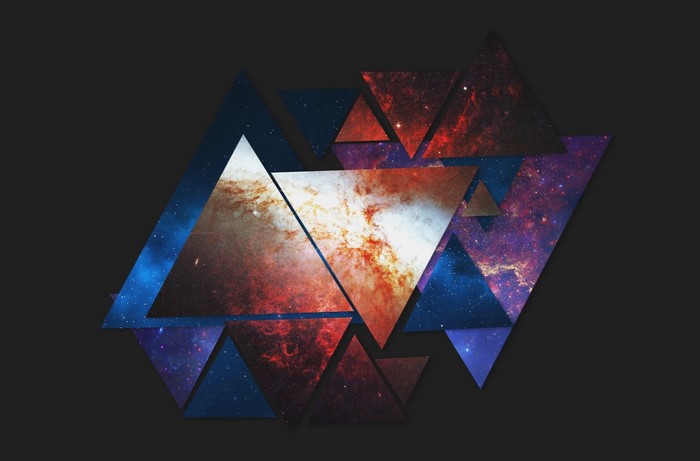 Abstract geometric triangles with space nebula patterns