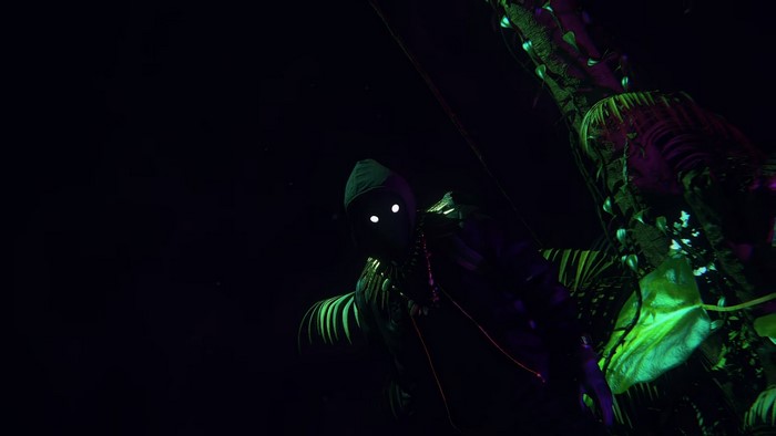 Survivor with glowing eyes in a dark jungle