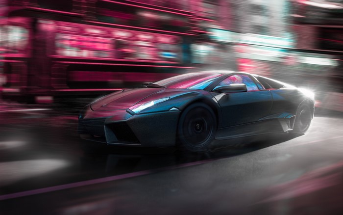 Black Lamborghini supercar in motion blur on a city street
