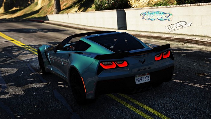 Blue Corvette driving on a road in Grand Theft Auto V