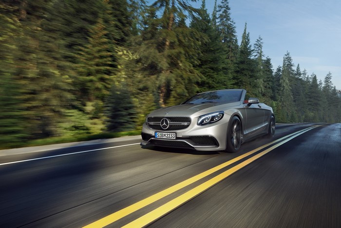 Silver Mercedes-Benz Convertible Driving on a Forest Road
