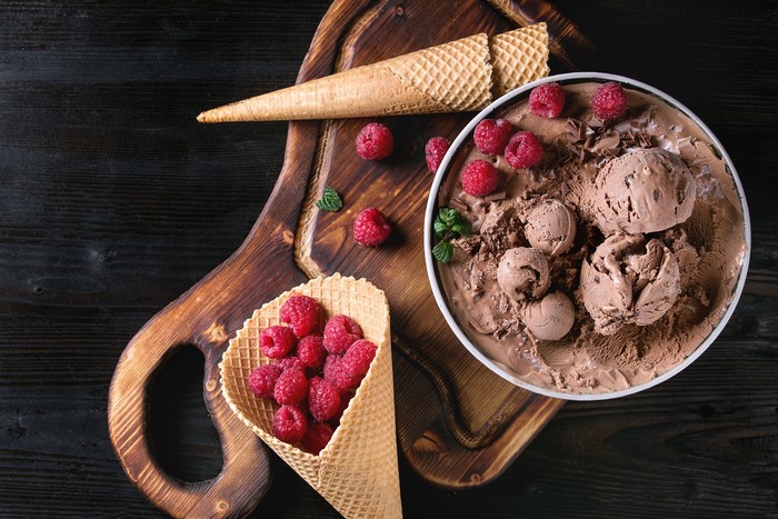 Chocolate ice cream with raspberries and waffle cones
