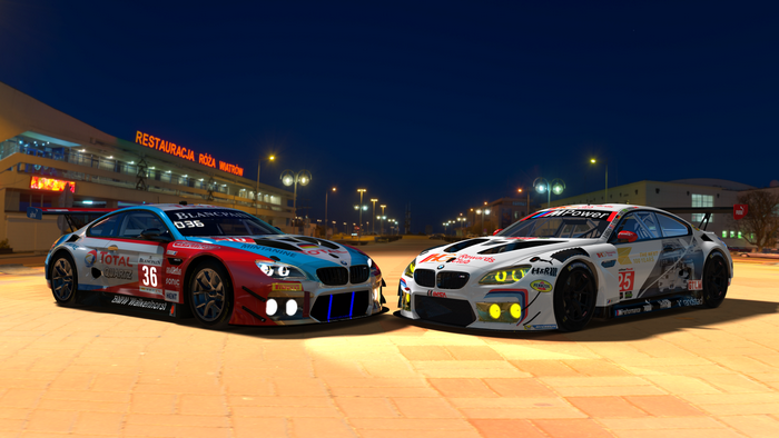 Two BMW M6 GT3 race cars at night