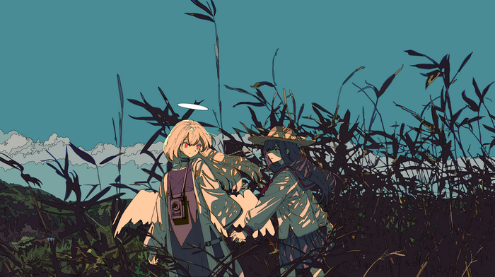 Two girls with wings and a hat in a field