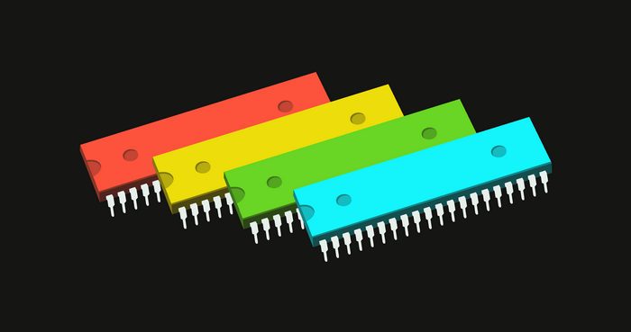 Four colorful microchips on a black background