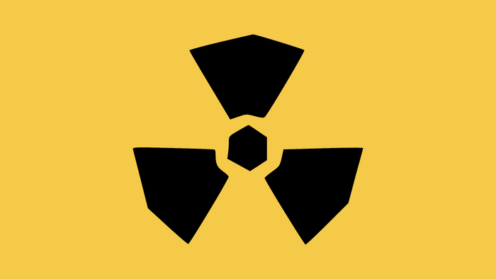 Radioactive symbol on yellow background