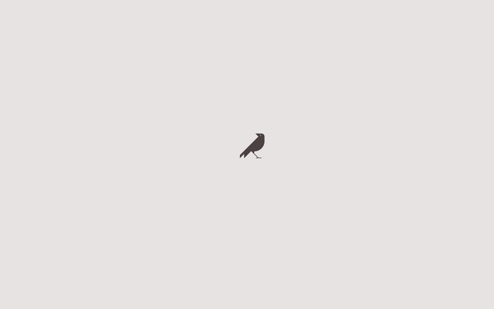 A minimalist silhouette of a crow on a plain background