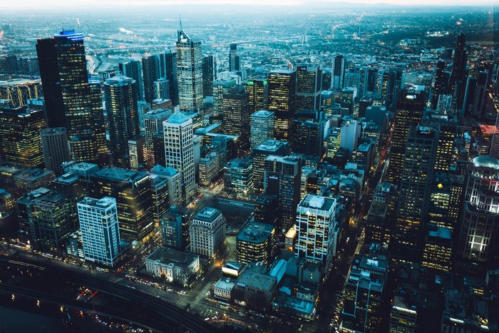 Aerial view of Melbourne cityscape at dusk with city lights