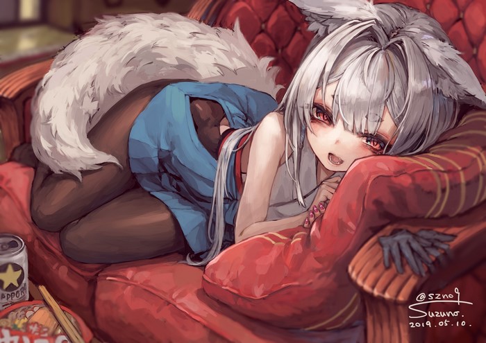 Suzuno, a fox girl, relaxing on a couch