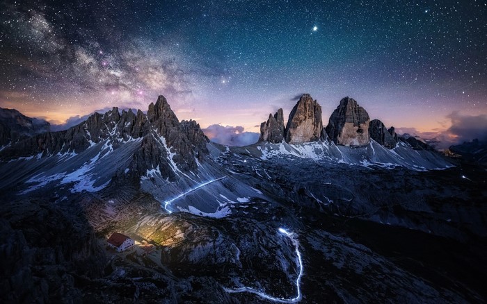Milky Way over Tre Cime di Lavaredo mountains at night