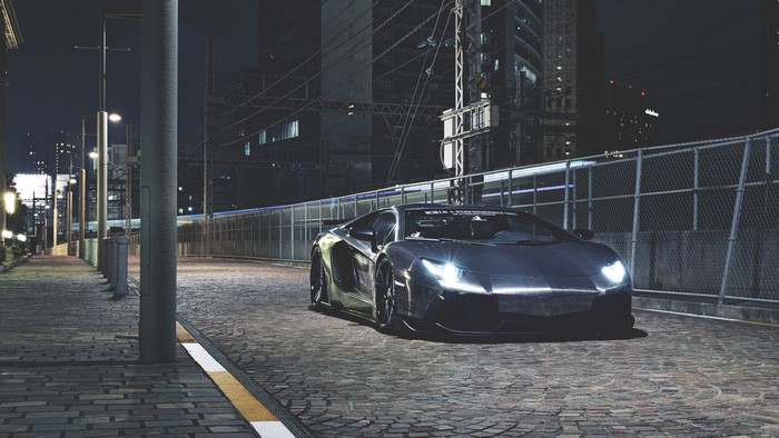 Dark night street with a Lamborghini Aventador