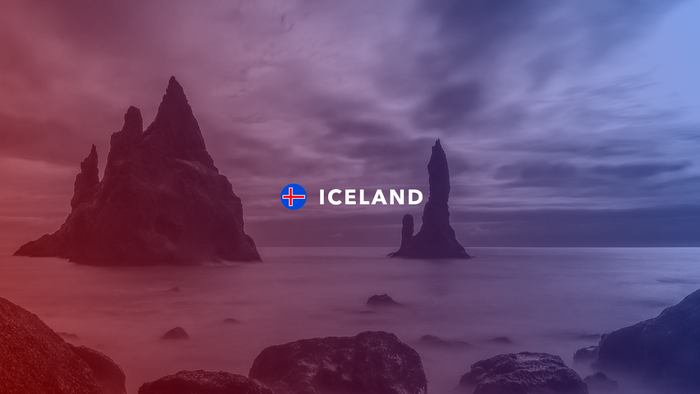 Iceland flag and text over rocky coastline