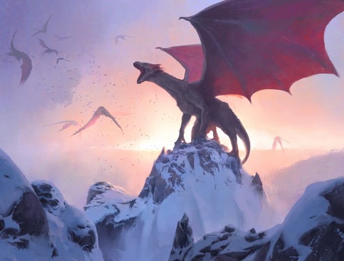 Dragons flying over snowy mountains at sunrise